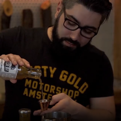 Bartender focusing on making a cocktail